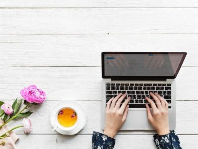 girl typing on her laptop