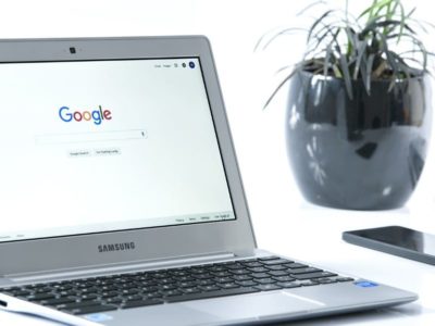 Google search homepage displayed in a laptop