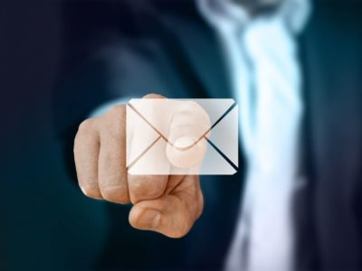 hand pointing to an email icon