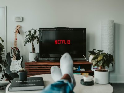 feet on table while watching netflix on television