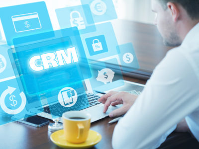 concept photo of a woman looking at CRM screen